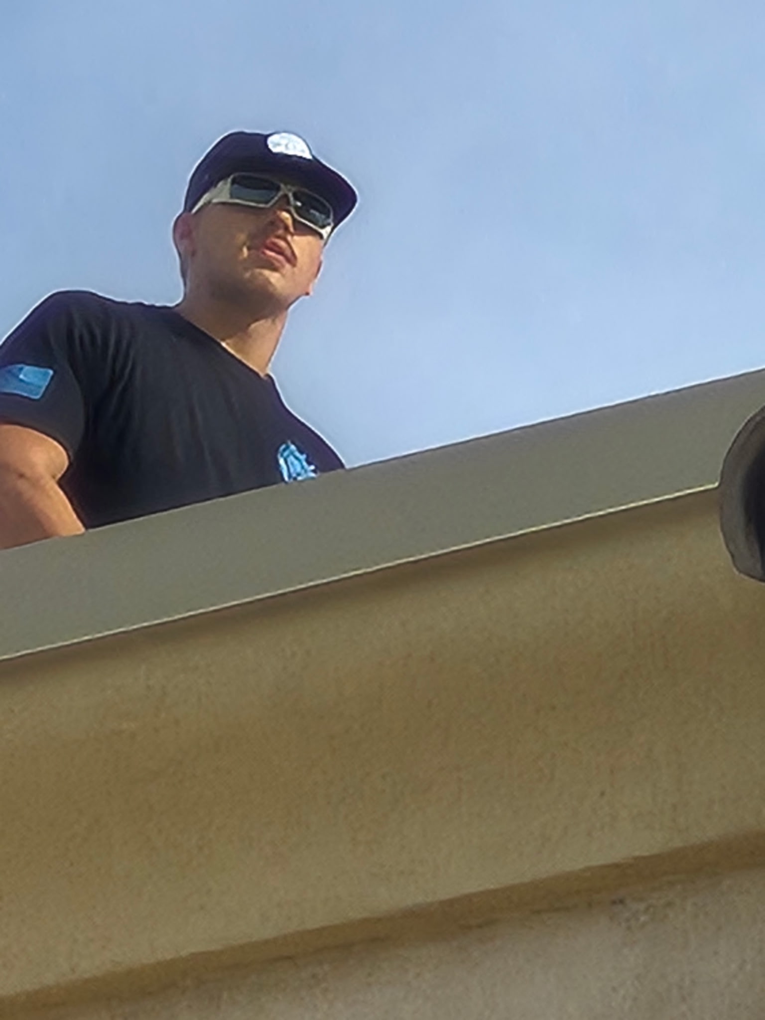 Technician performing rooftop HVAC service